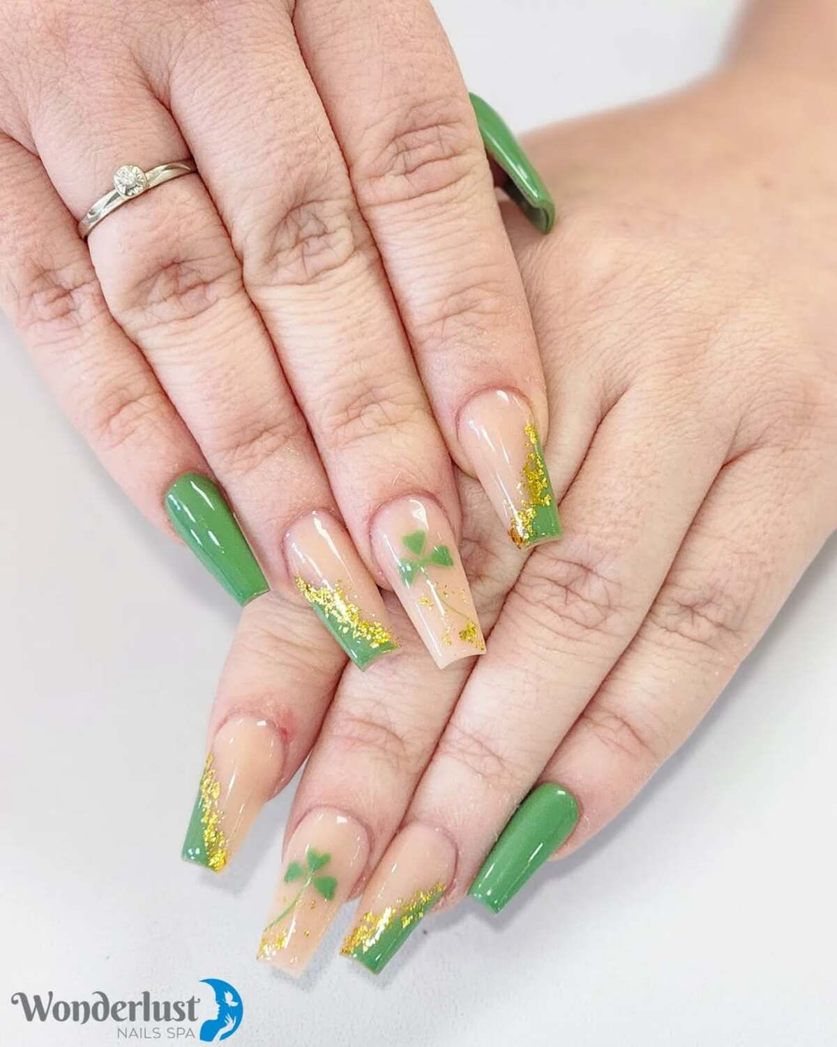 9. Subtle Clover French Tips with Golden Highlights