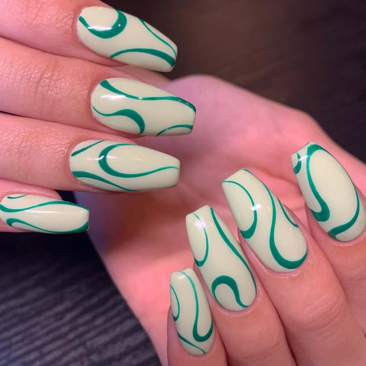 8. Minimalist Green Swirl Design