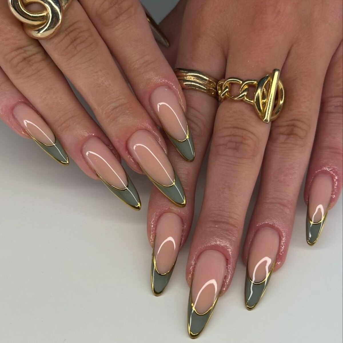 2. Gold-Tipped Sage French Nails