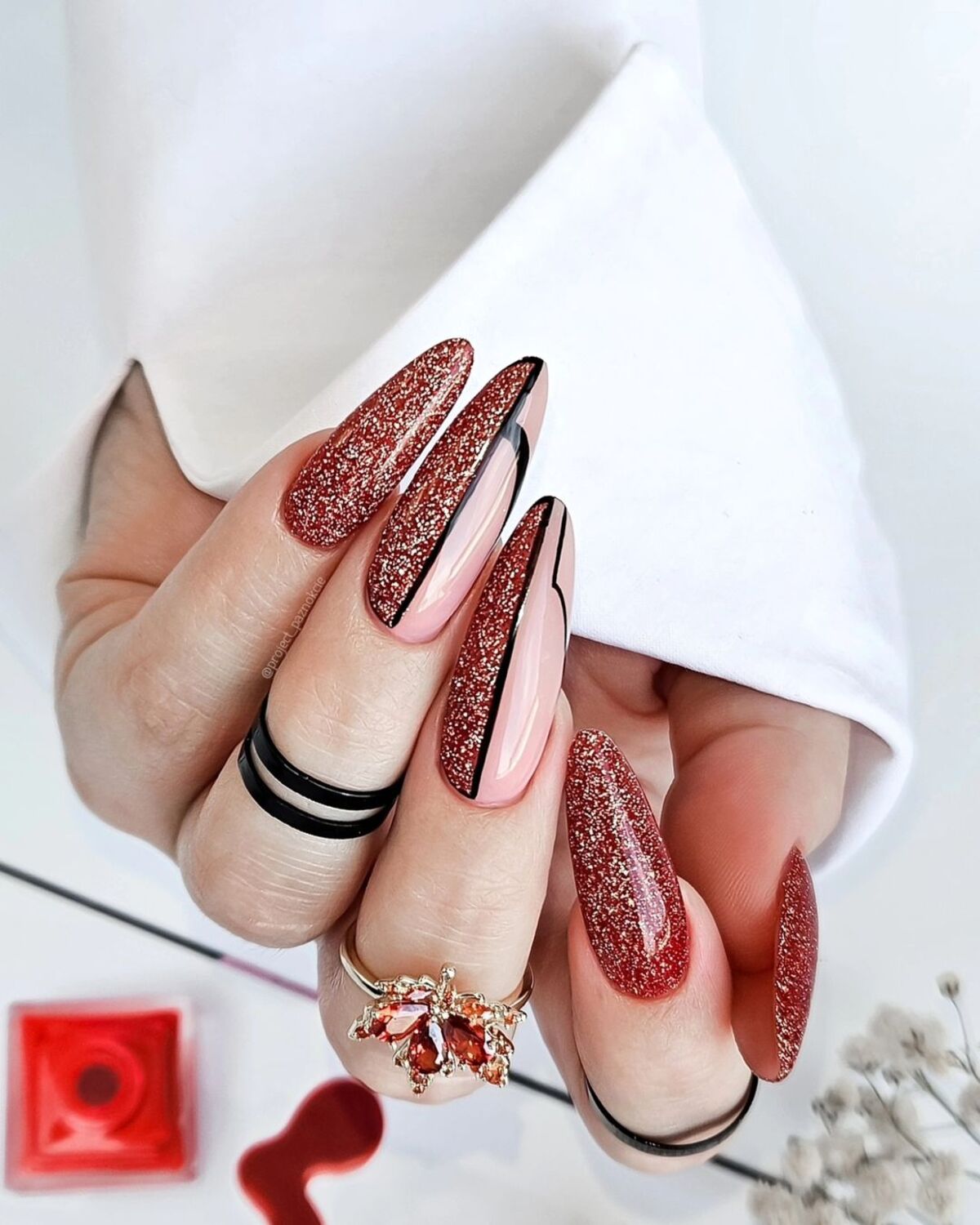 24. Fiery Red Glitter and Black Accents