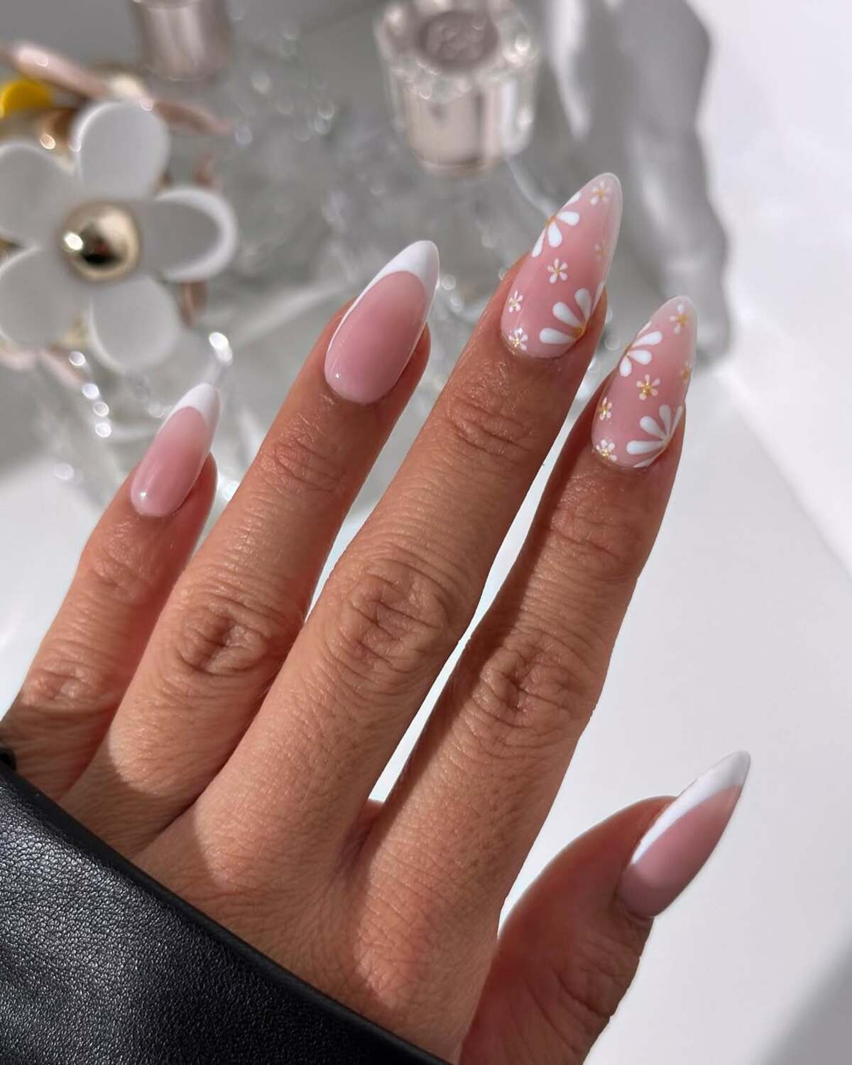 11. White French Tips with Delicate Daisy Clusters