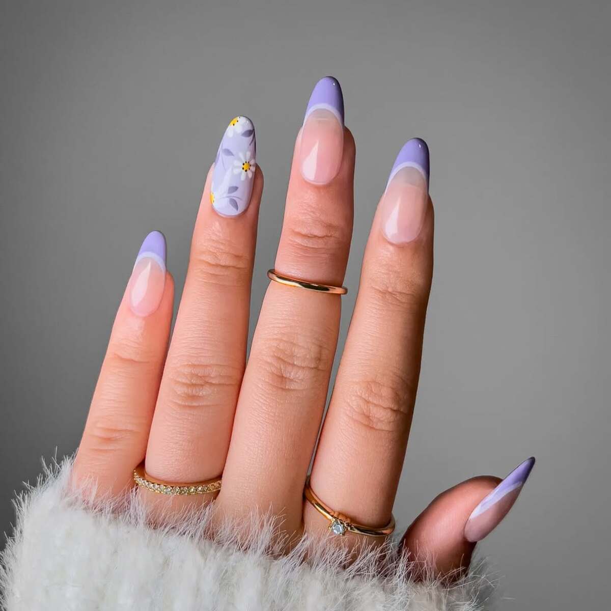 20. Purple French Tips with a Floral Statement Nail