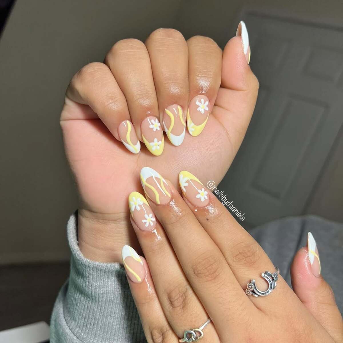 21. Swirled Yellow and White French Tips with Daisy Accents