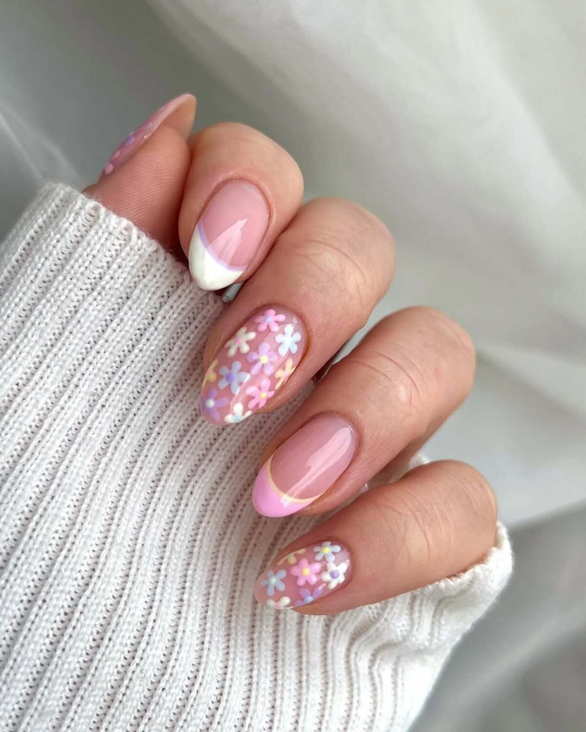 25. Delicate Pastel Flowers with White and Pink French Tips