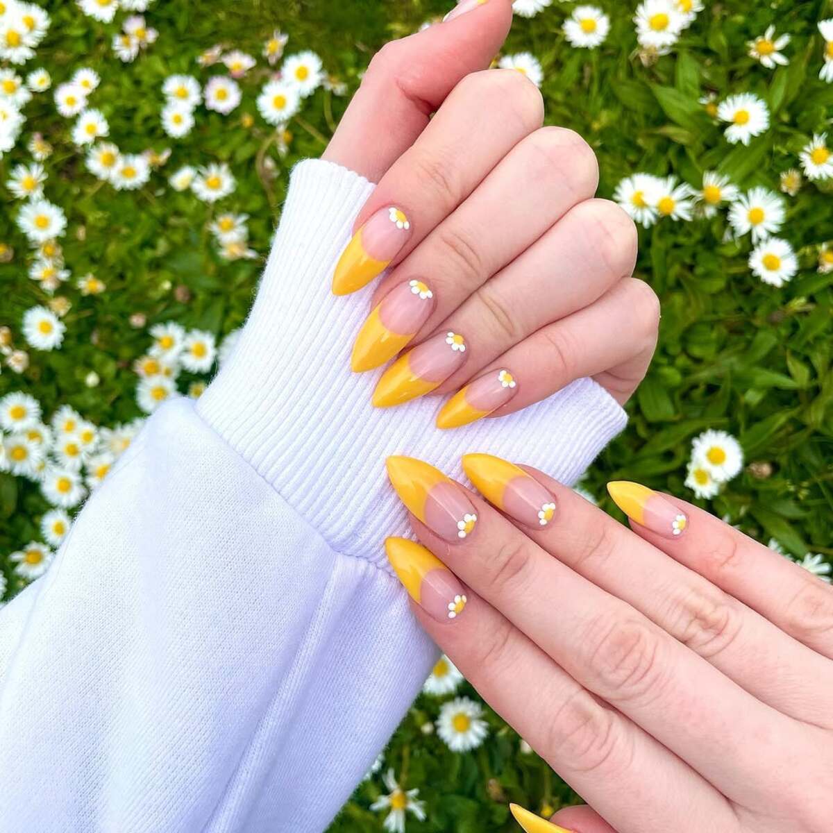 9. Bold Sunshine Yellow French Tips with Daisy Details