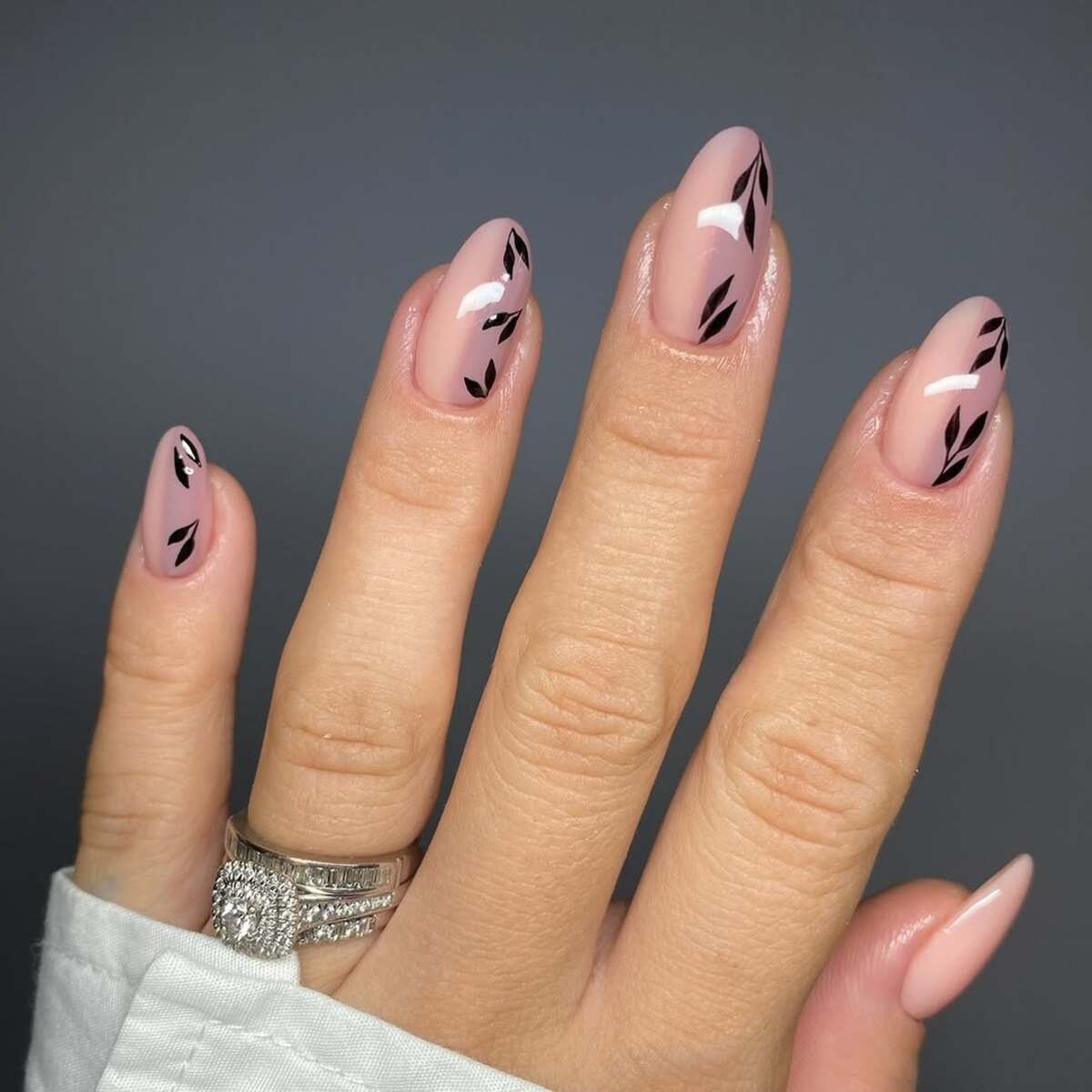 7. Classic Nude with Black Leaf Accents