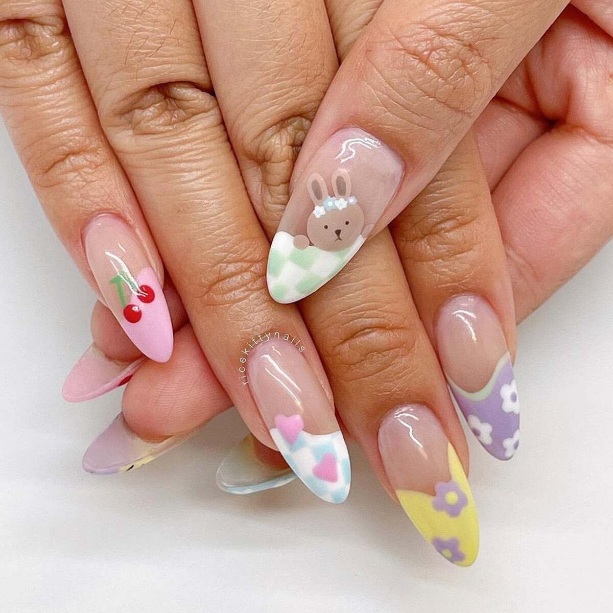 13. Playful Mix-and-Match Pastel Nail Art