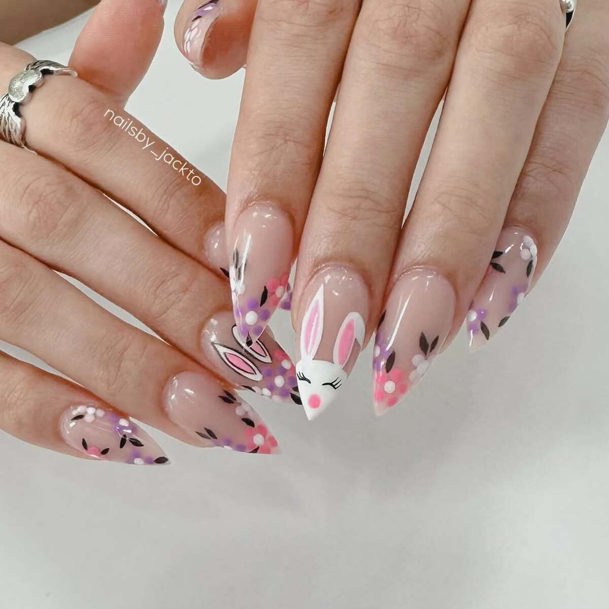 14. Floral Bunny Accents on Glossy Almond Nails