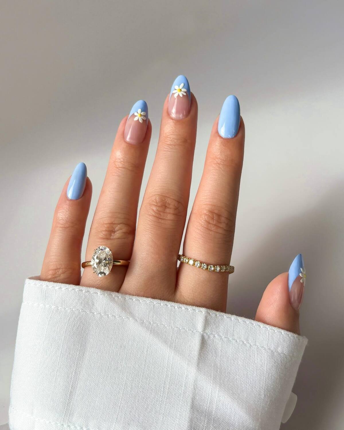 1. Minimalist Blue Accents with Daisy Charms