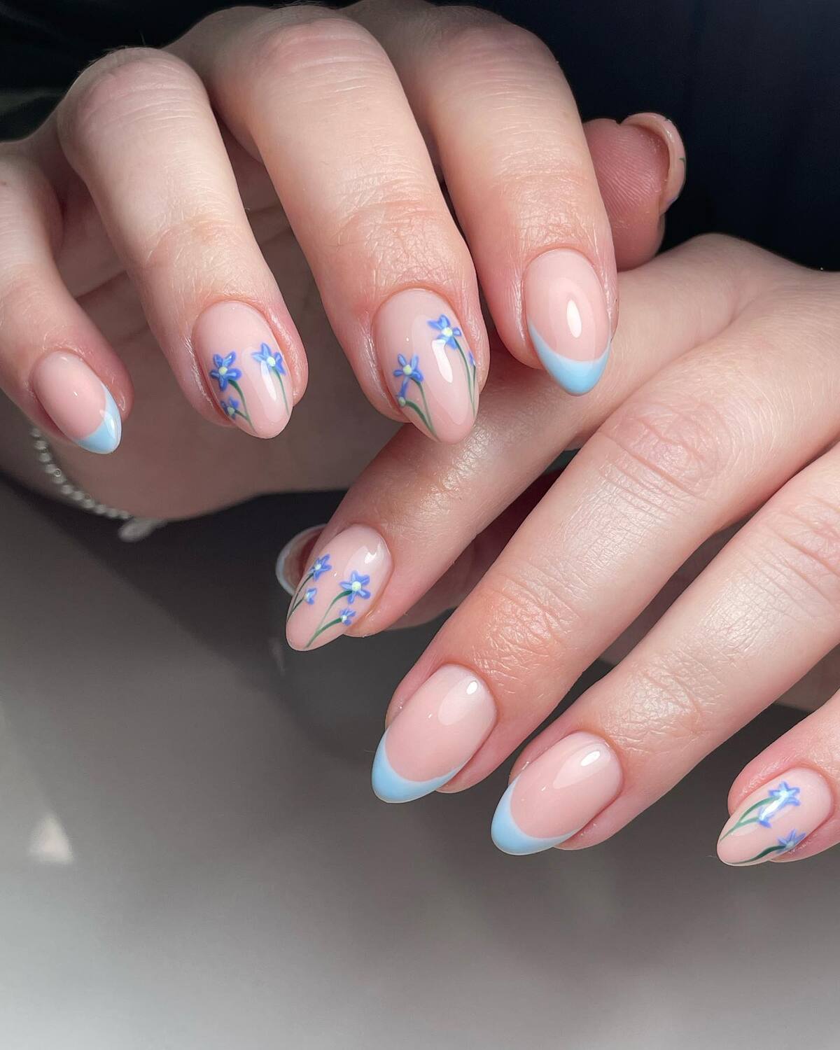 14. Delicate Blue Florals with Subtle French Tips