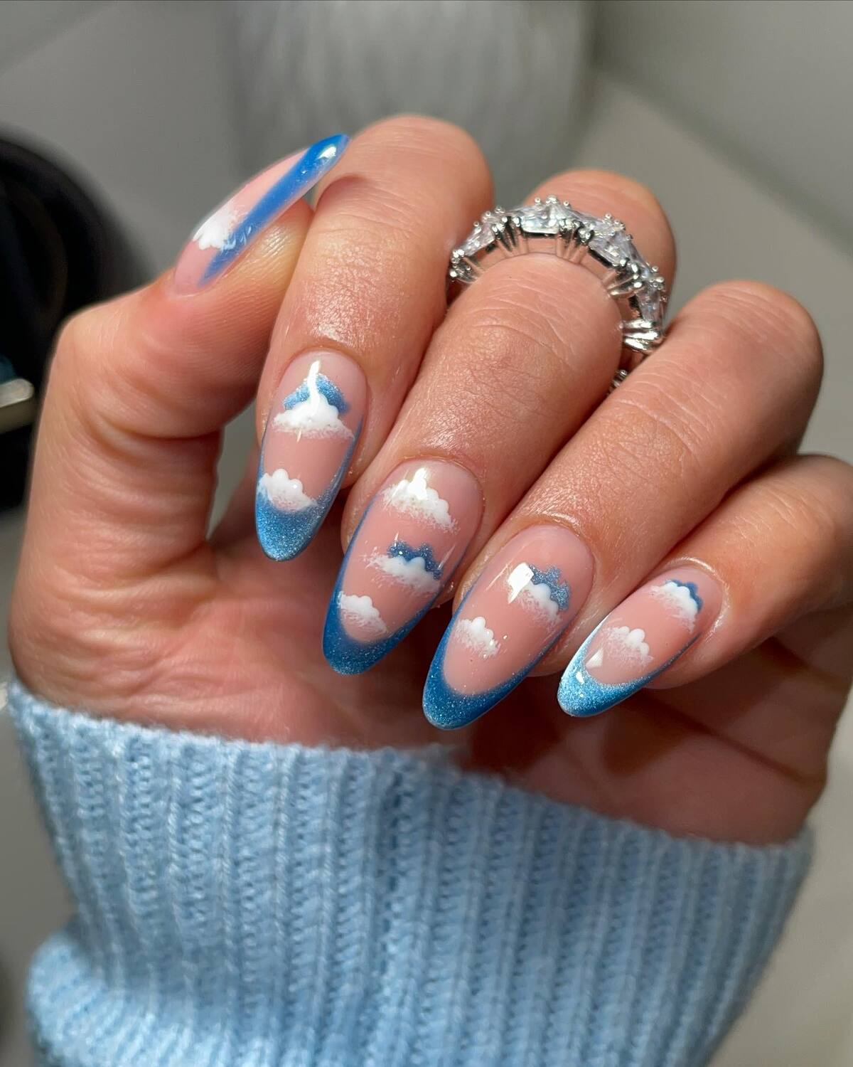 18. Cloudy Blue Skies Nail Art