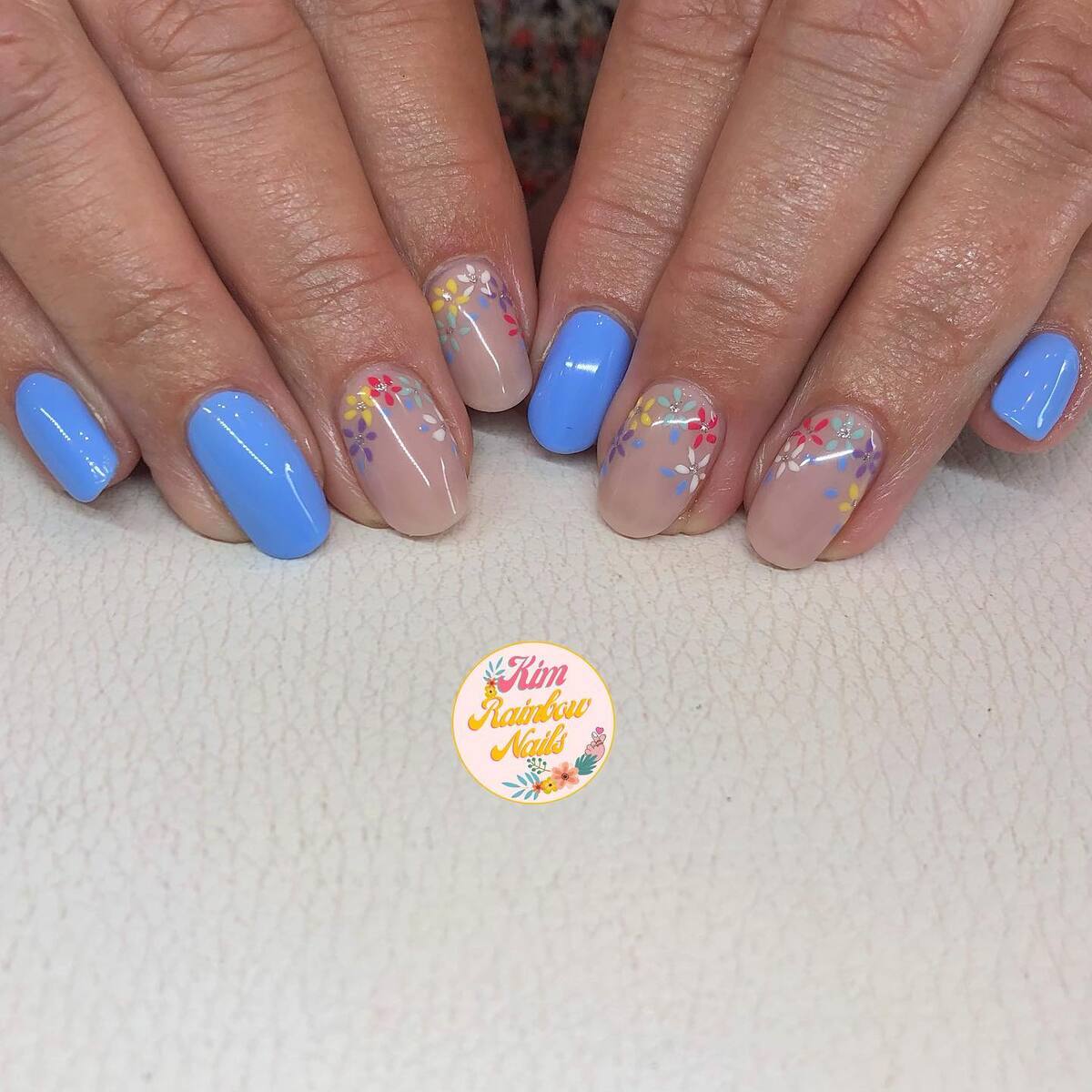 24. Subtle Florals with Bright Blue Polish