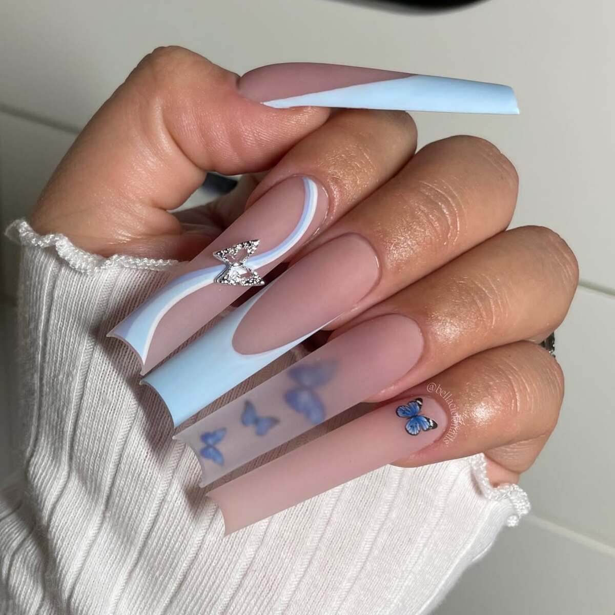 10. Modern Blue French Tips with Floral Overlays