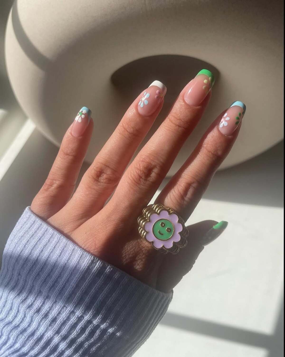 11. Green and Blue French Tips with Playful Florals