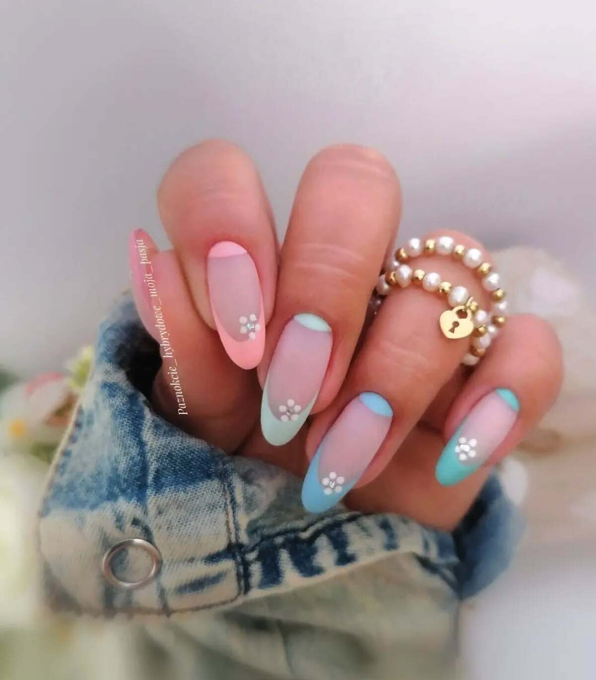 26. Matte Pastel French Tips with Minimal Florals