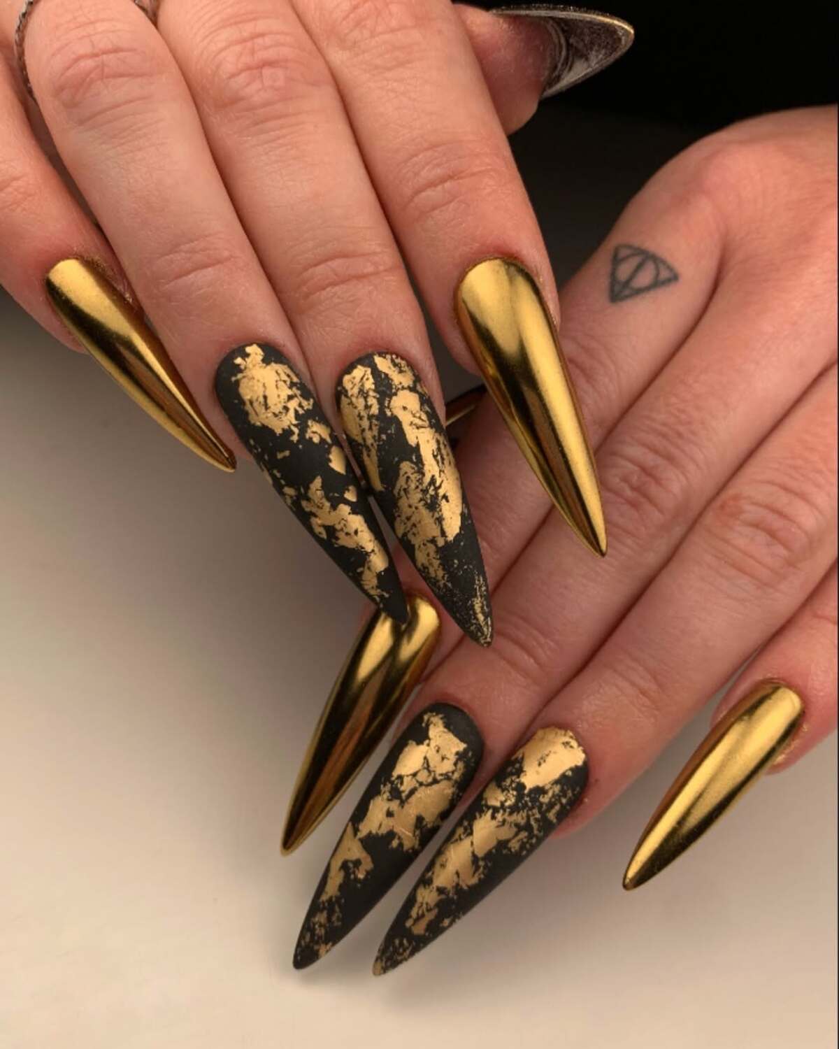 1. Bold Elegance with Gold Chrome and Black Marble