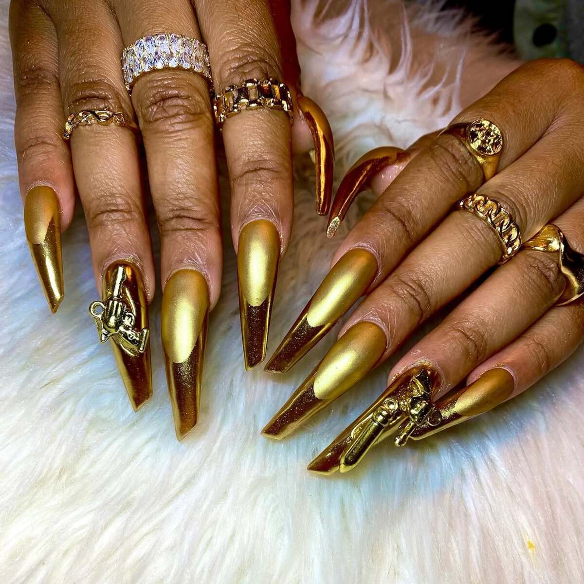 11. Matte Gold Glam with Intricate Charms