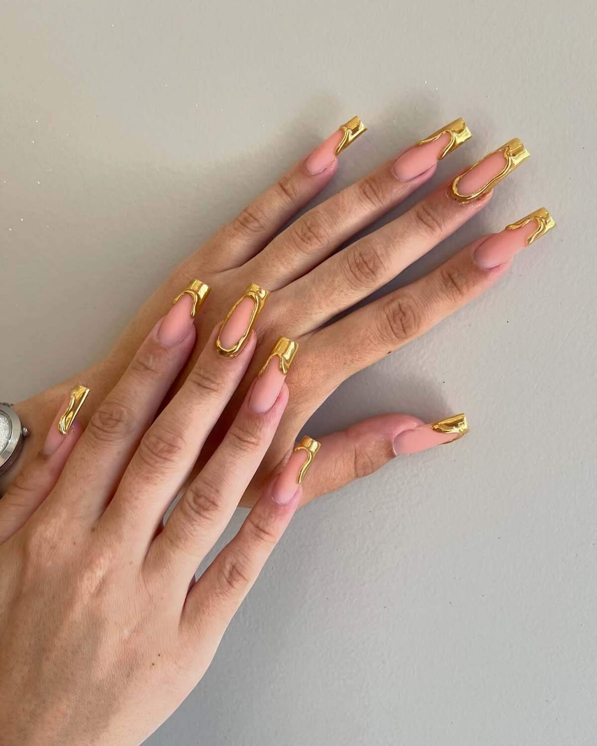 12. Sculptural Gold Frames on Nude Nails