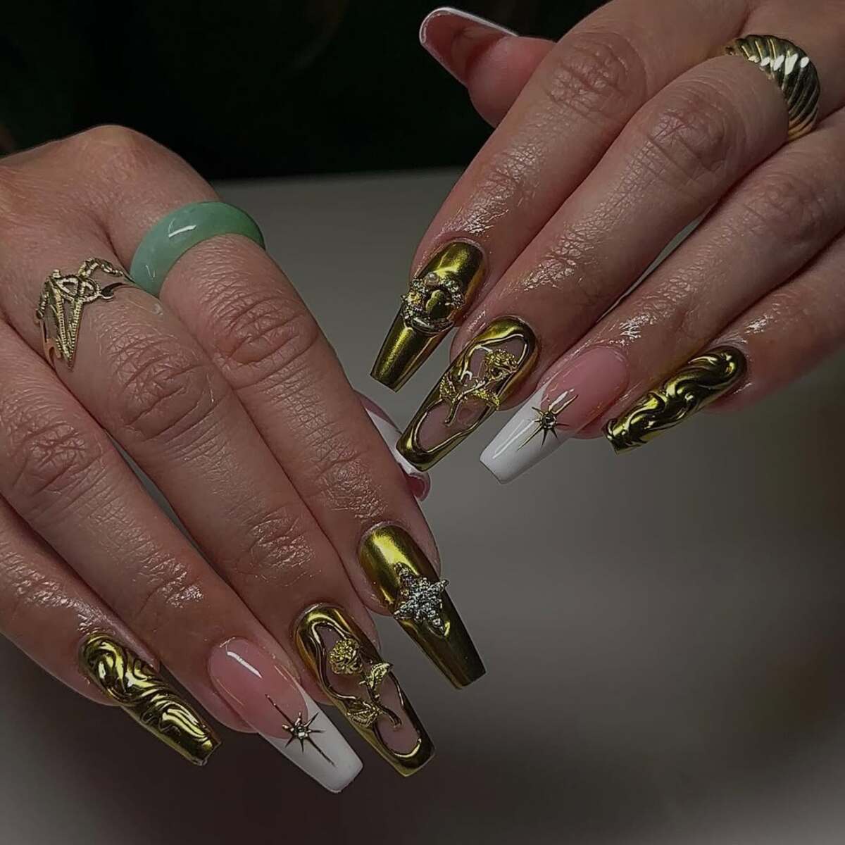 17. Botanical Gold Accents on Coffin Nails